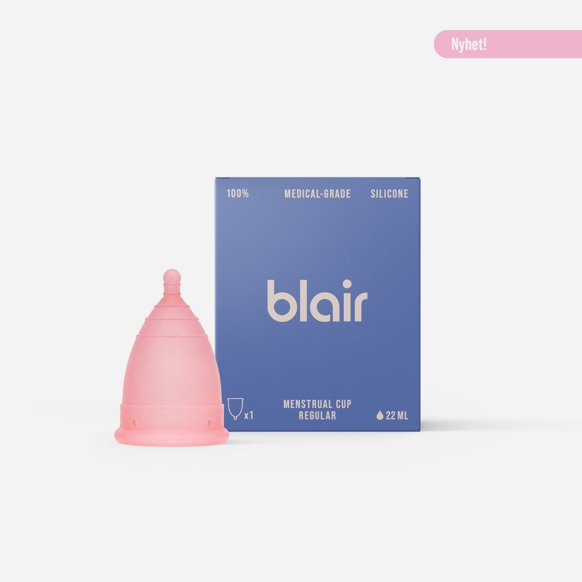En Blair-förpackning med en menskopp på en grå bakgrund